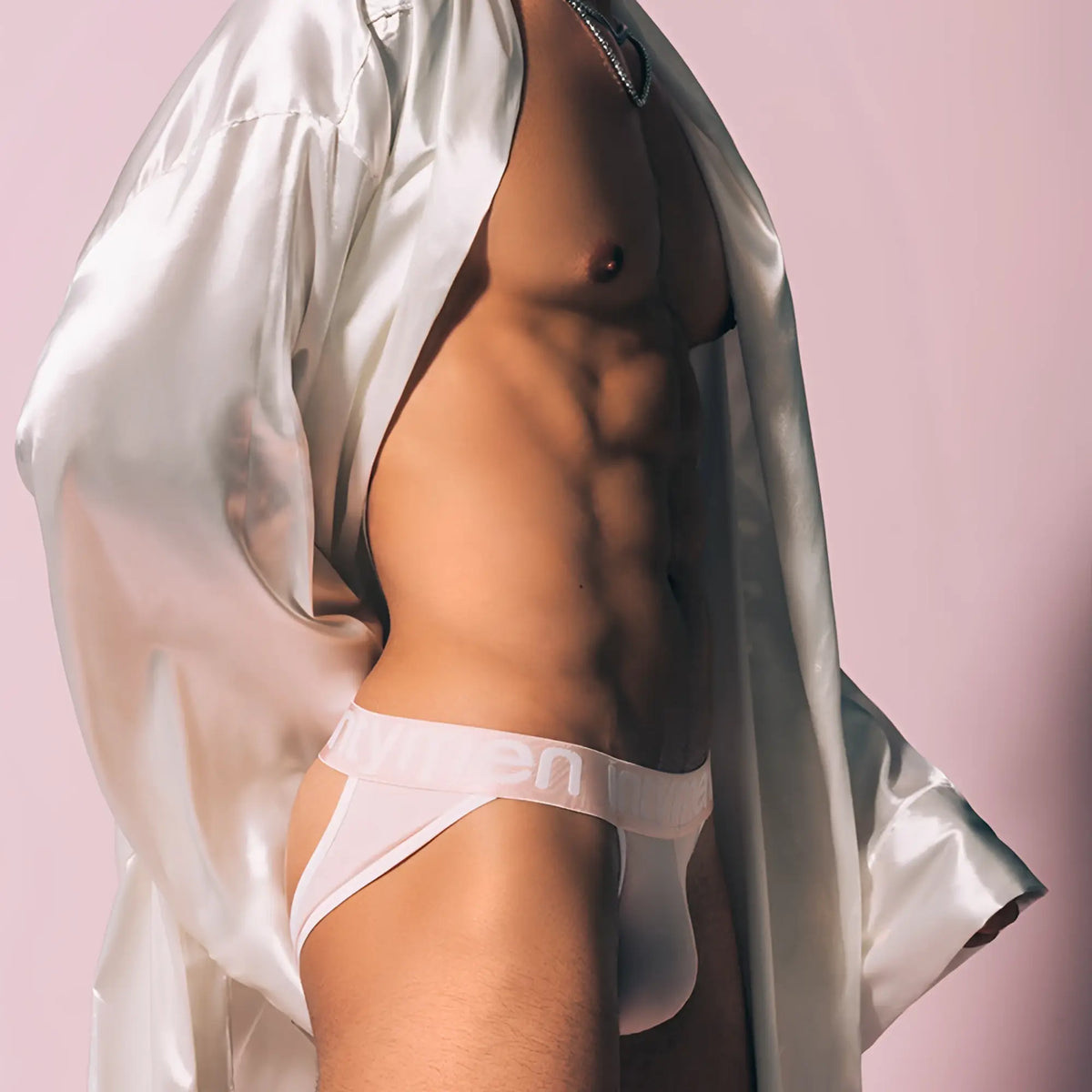 White Intymen INE023 jockstrap athletic briefs with subtle logo on waistband front view made of breathable fabric