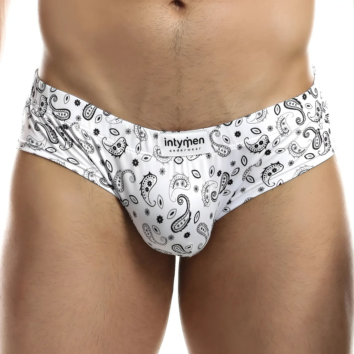 White menâ€™s briefs with black paisley and floral patterns featuring intymen underwear branded label ing067 boxer trunk