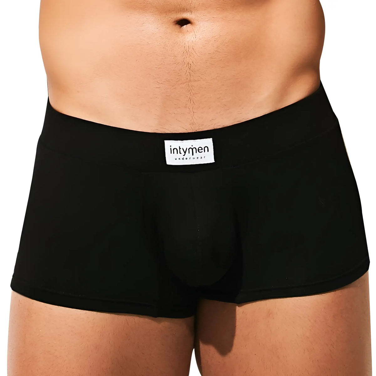 Black menâ€™s briefs with white intymen underwear label on waistband from intymen ing074 boxer trunk collection
