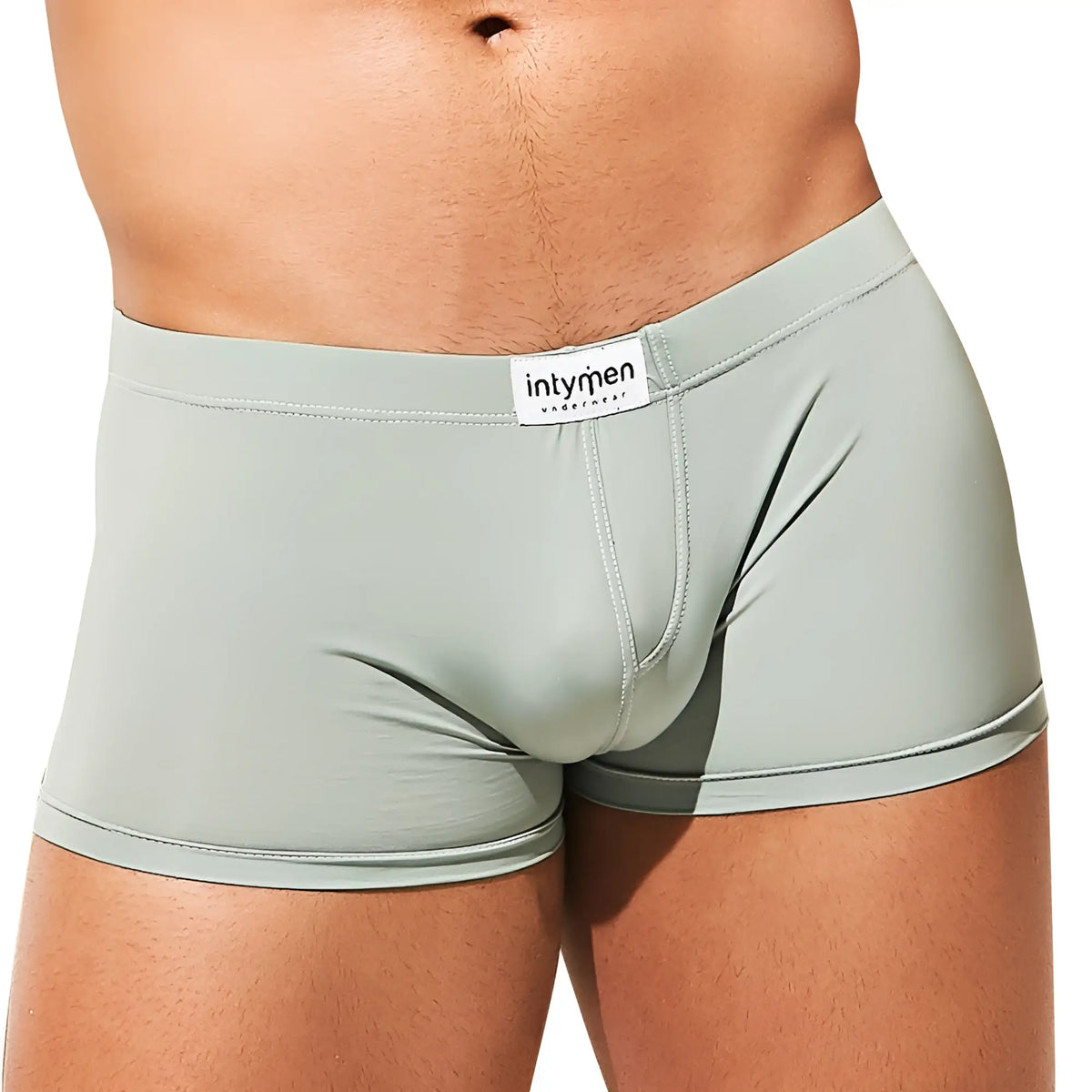 Light green form-fitting boxer trunk by intymen featuring a white branded waistband tag model ing075