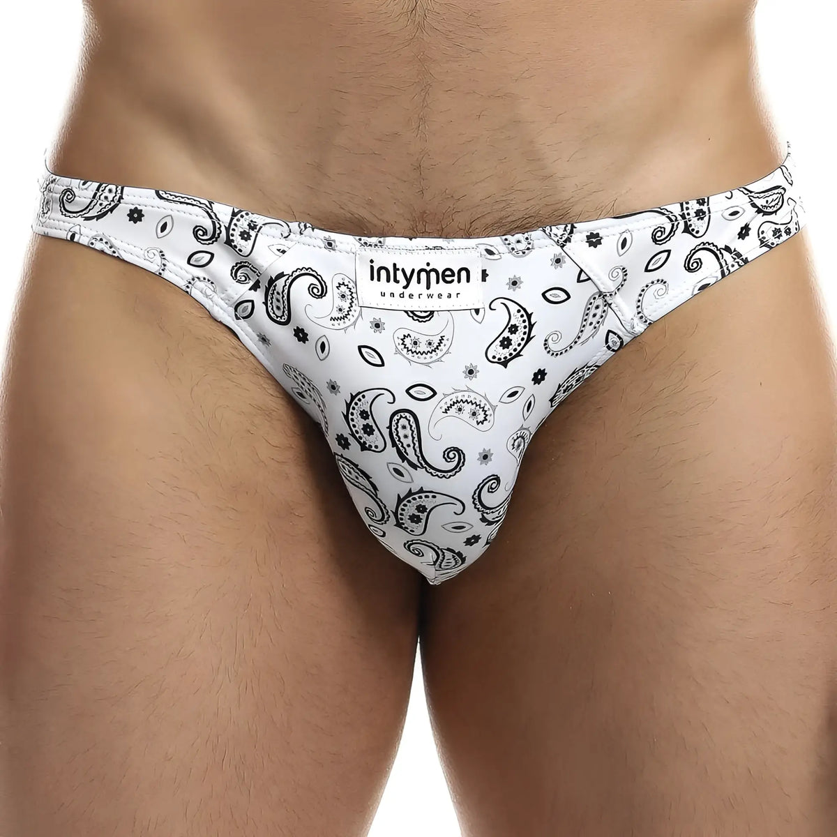 White menâ€™s briefs with black paisley and floral patterns featuring intymen underwear label ini027 bikini brief