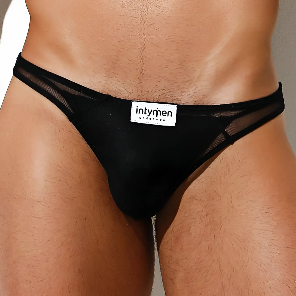Black mesh thong bikini brief with solid fabric front and Intymen brand label by Intymen INI031