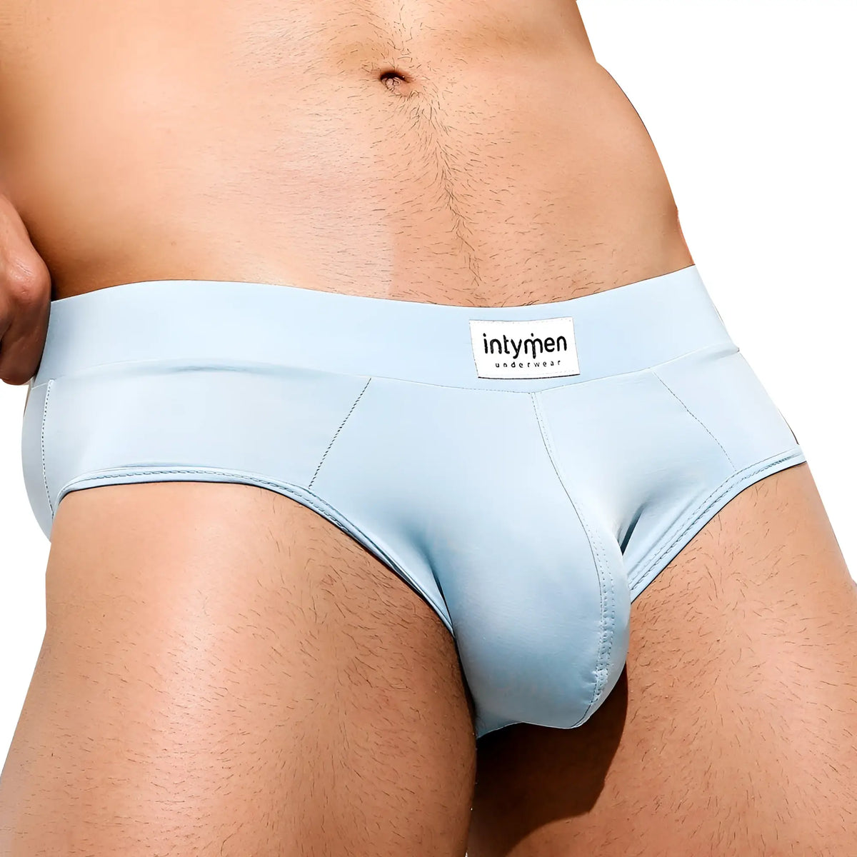 Light blue smooth textured Intymen INJ062 brief with subtle seam design and Intyren underwear label on waistband