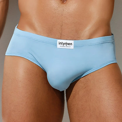 Light blue form-fitting briefs with white intyren underwear label on waistband from intymen inj065 brief collection
