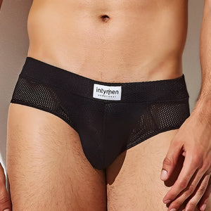 Black mesh briefs with white intymen underwear label on waistband from intymen inj080 brief collection