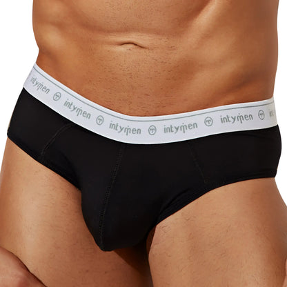 Black menâ€™s briefs intymen inj088 with white elastic waistband featuring intyqmen brand name and logo repeated