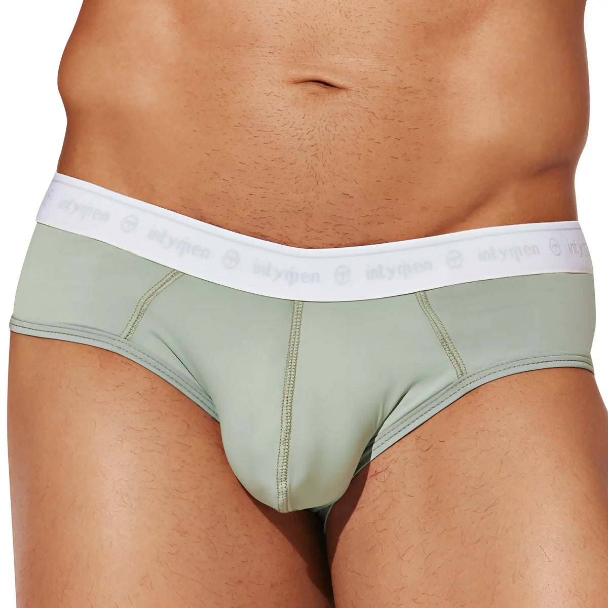 Intymen inj088 brief in mint green with a white elastic waistband featuring the intymen logo repeated