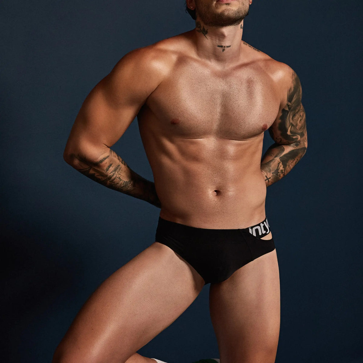 Black Intymen INJ095 brief with a white logo waistband offering comfortable supportive underwear