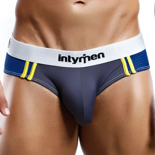 Dark blue intymen INT6141 brief with white waistband logo and bright yellow side stripes athletic underwear