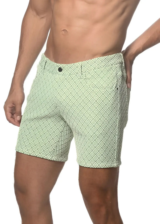 Light green jacquard printed stretch knit shorts with repeating dark green geometric pattern button closure and belt loops