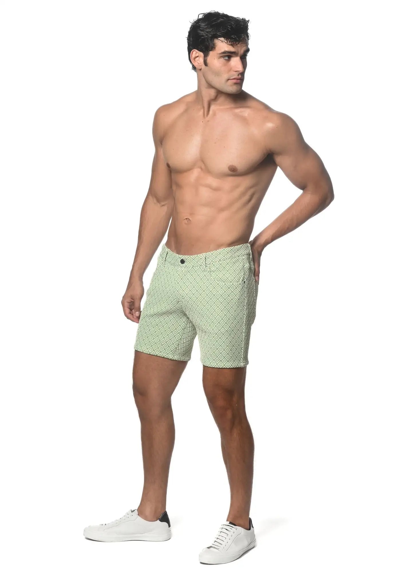 Light green jacquard printed stretch knit shorts with a subtle geometric pattern and textured fabric
