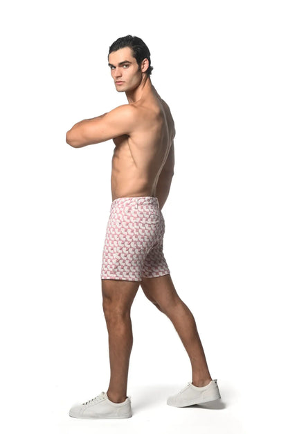 Men’s pink and white jacquard printed stretch knit short swim trunks with geometric pattern