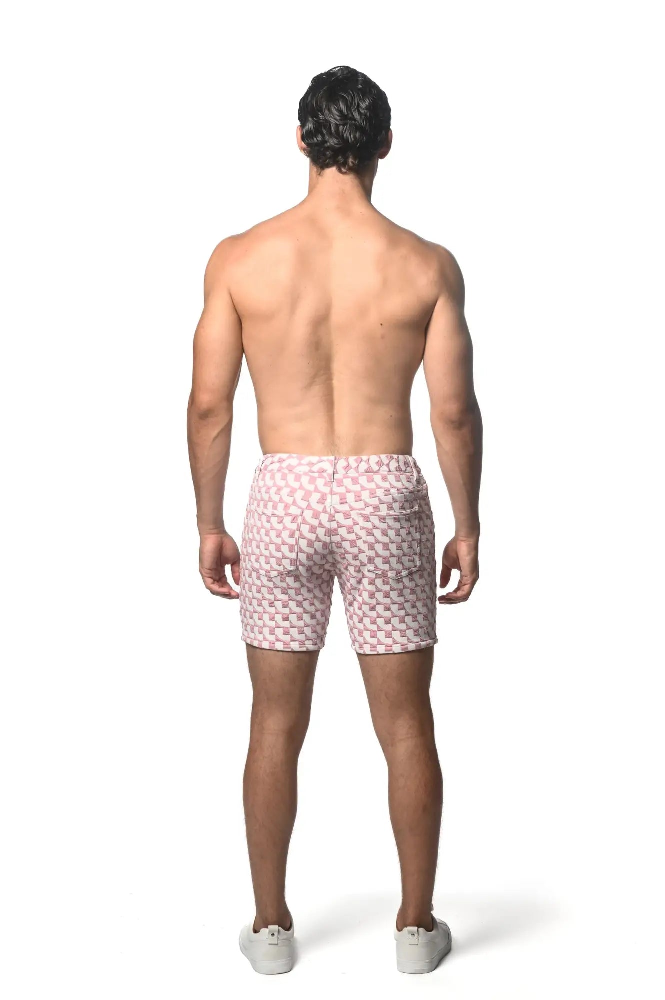 Pink and white jacquard printed stretch knit short swim trunks with geometric pattern for casual beachwear