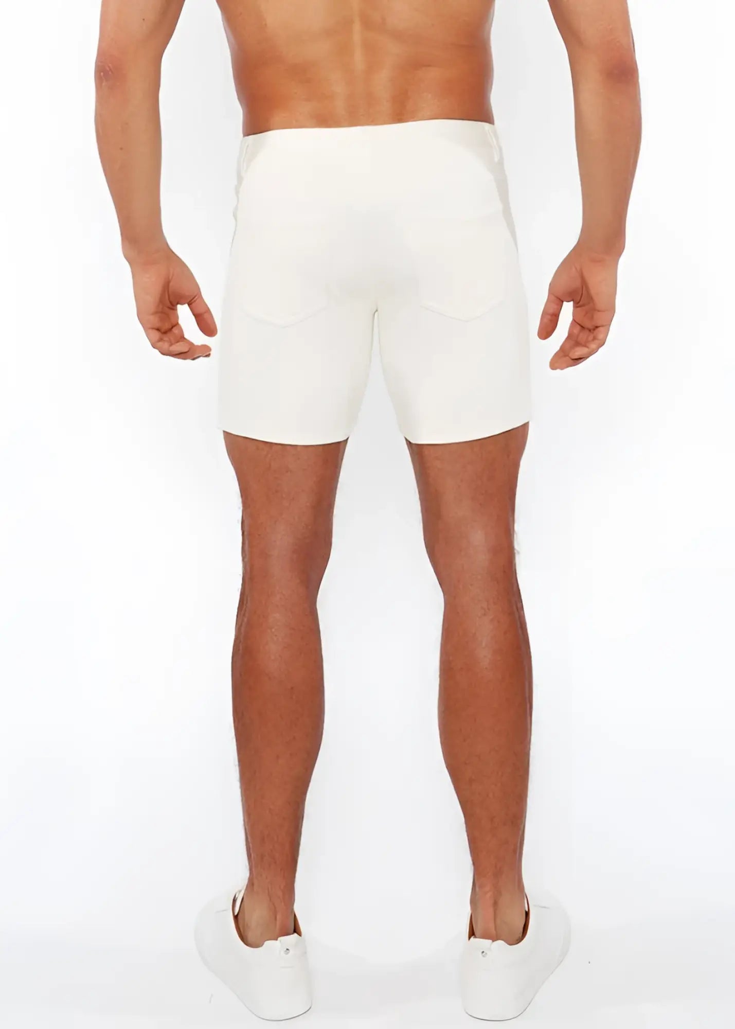 White jaquard stretch knit chino shorts with a sleek form-fitting design and subtle stitching details