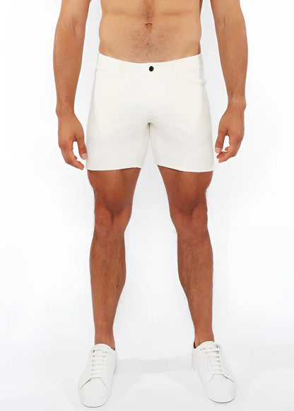 White jaquard stretch knit chino shorts with sleek form-fitting design and black button waistband