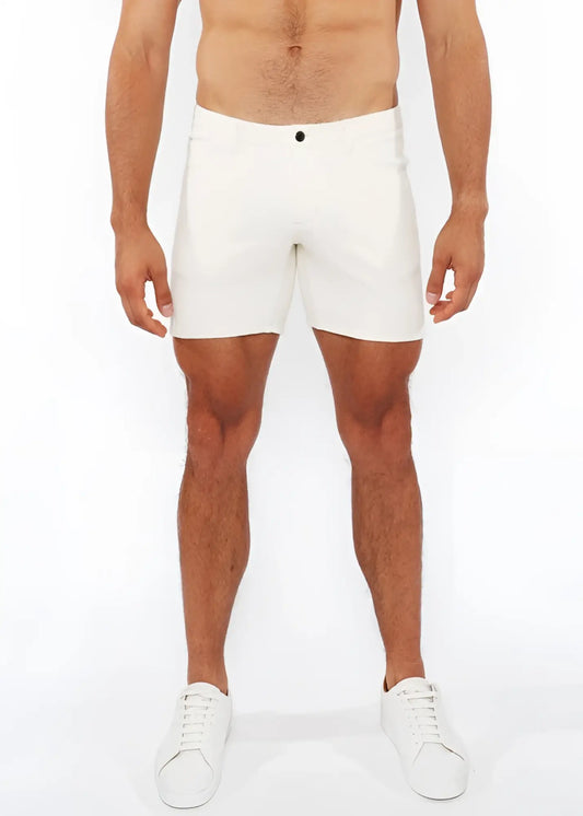 White jaquard stretch knit chino shorts with sleek form-fitting design and black button waistband