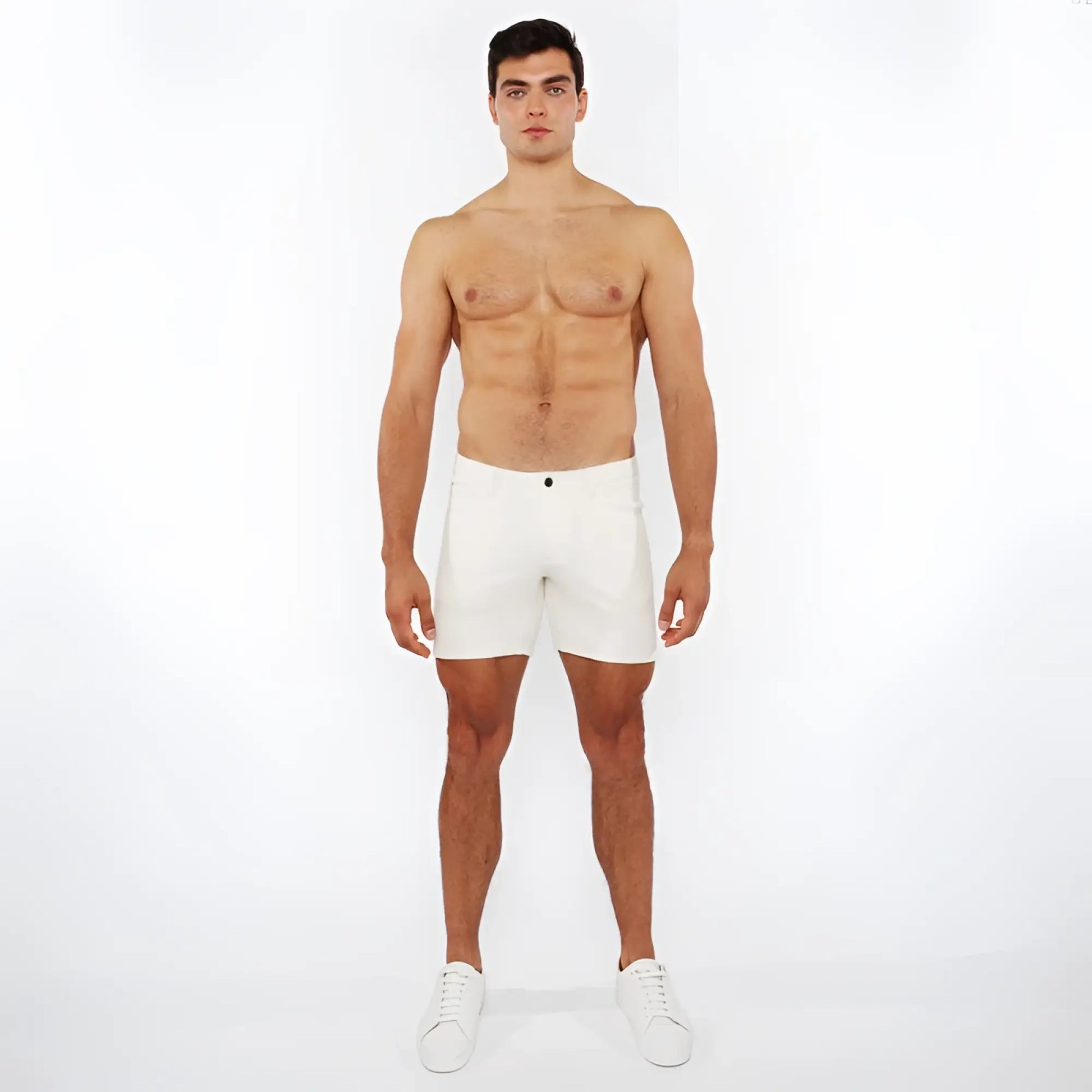 White jaquard stretch knit chino shorts with a sleek minimalist design and a black button at the waistband