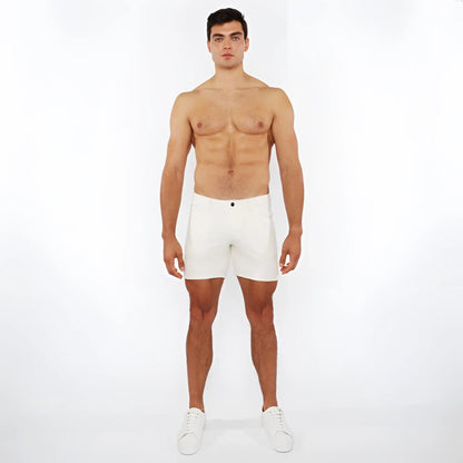 White jaquard stretch knit chino shorts with a sleek minimalist design and a black button at the waistband