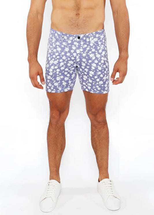 Purple floral-patterned jaquard stretch knit men’s shorts with black button closure for casual wear