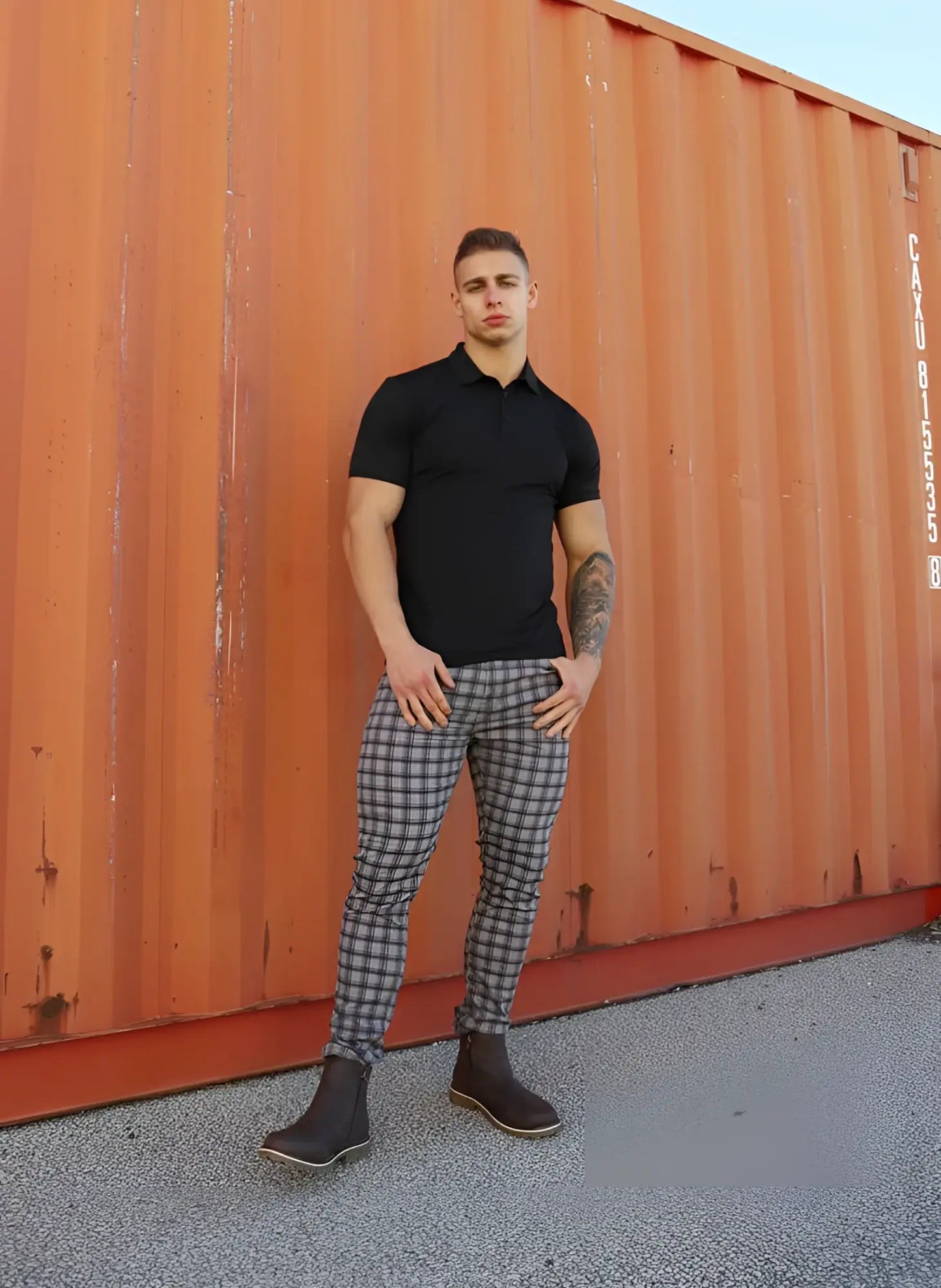 Black short-sleeved polo shirt with classic collar and fitted cut paired with jed north embassy grid grey pants size m