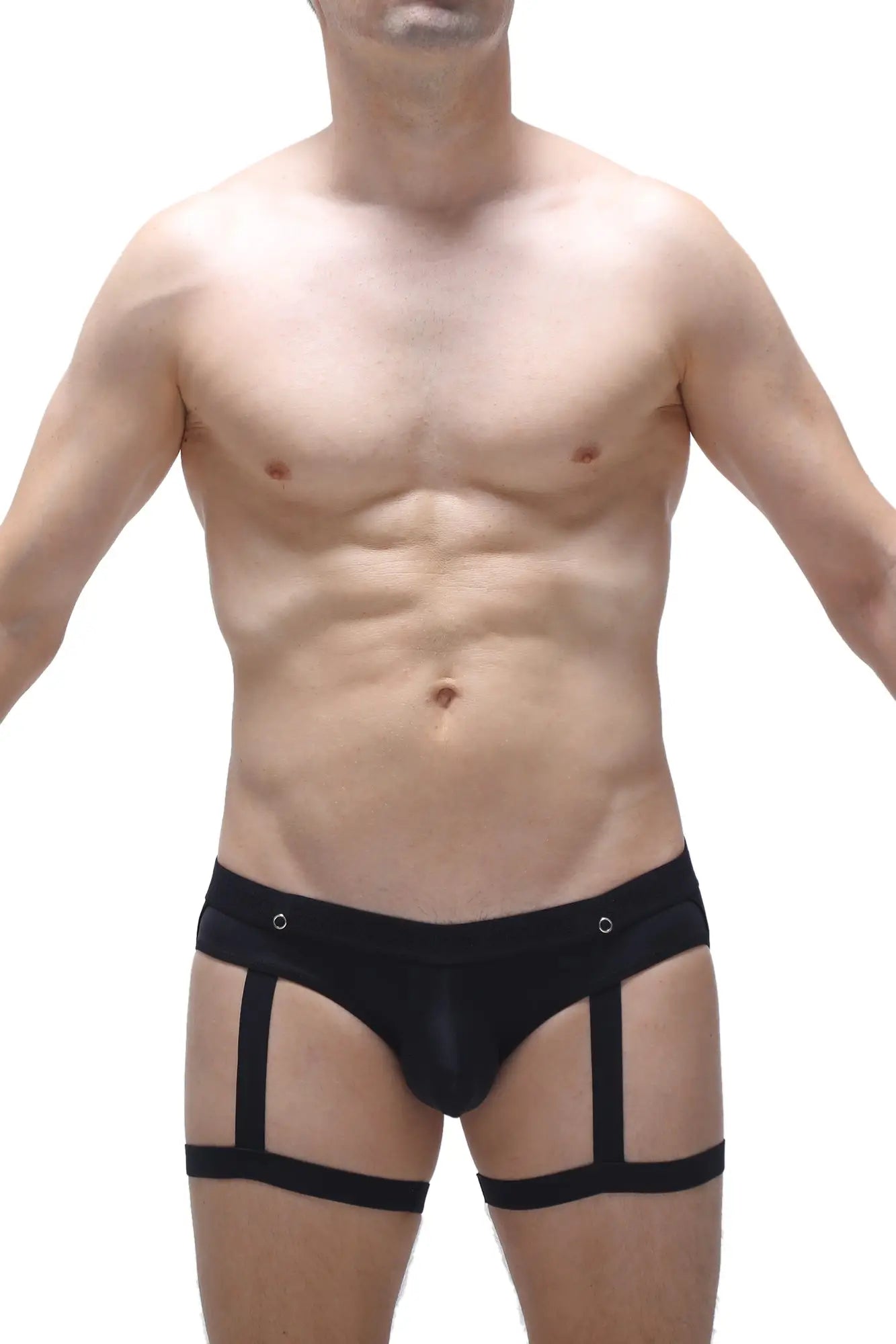 Black form-fitting jockstrap garter briefs with strappy design and metallic grommets at the waistband