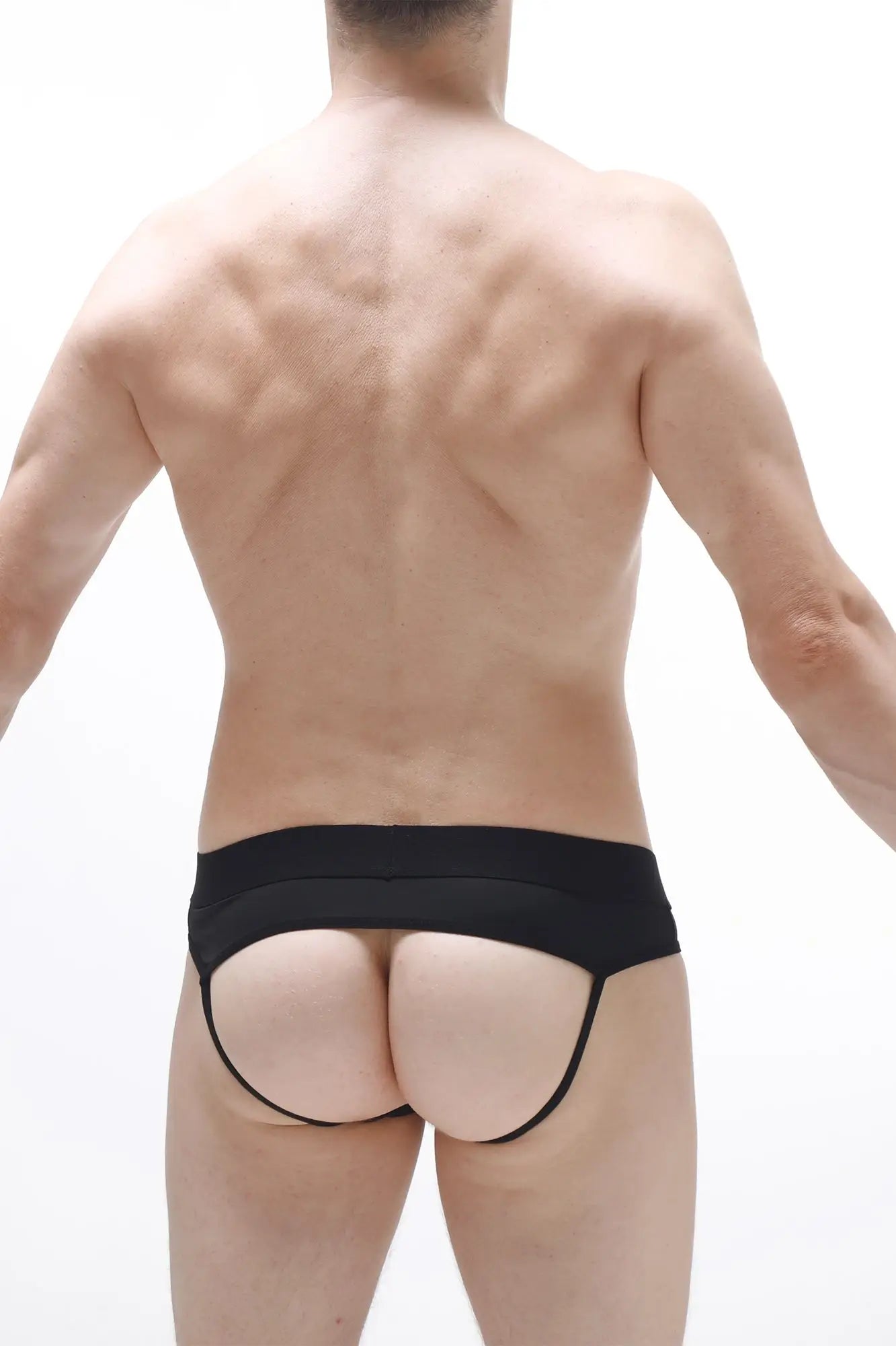 Black form-fitting jockstrap open traist with wide waistband and thin side straps shown from the back side