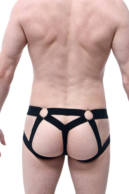 Black harness-style jockstring briefs with gold-toned metal rings at the waistband front view