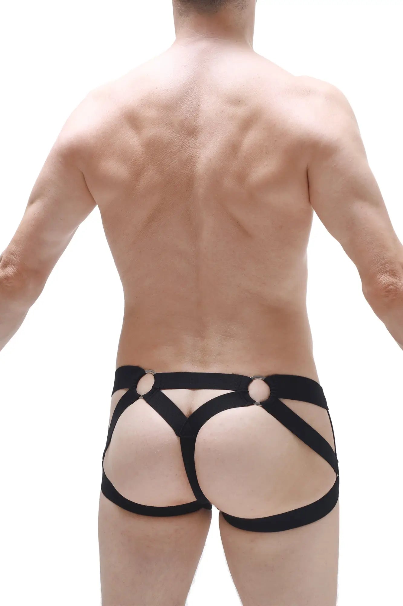 Black harness-style jockstring bustic briefs with bold straps and circular metal accents for edgy wear