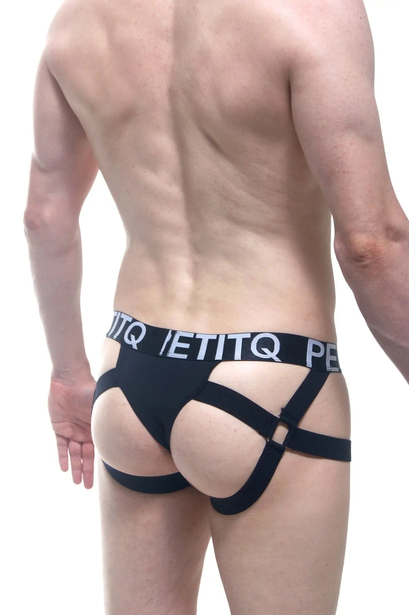 Black sleek jockstring seyre briefs with bold white etitq logo band and crisscrossing straps for men
