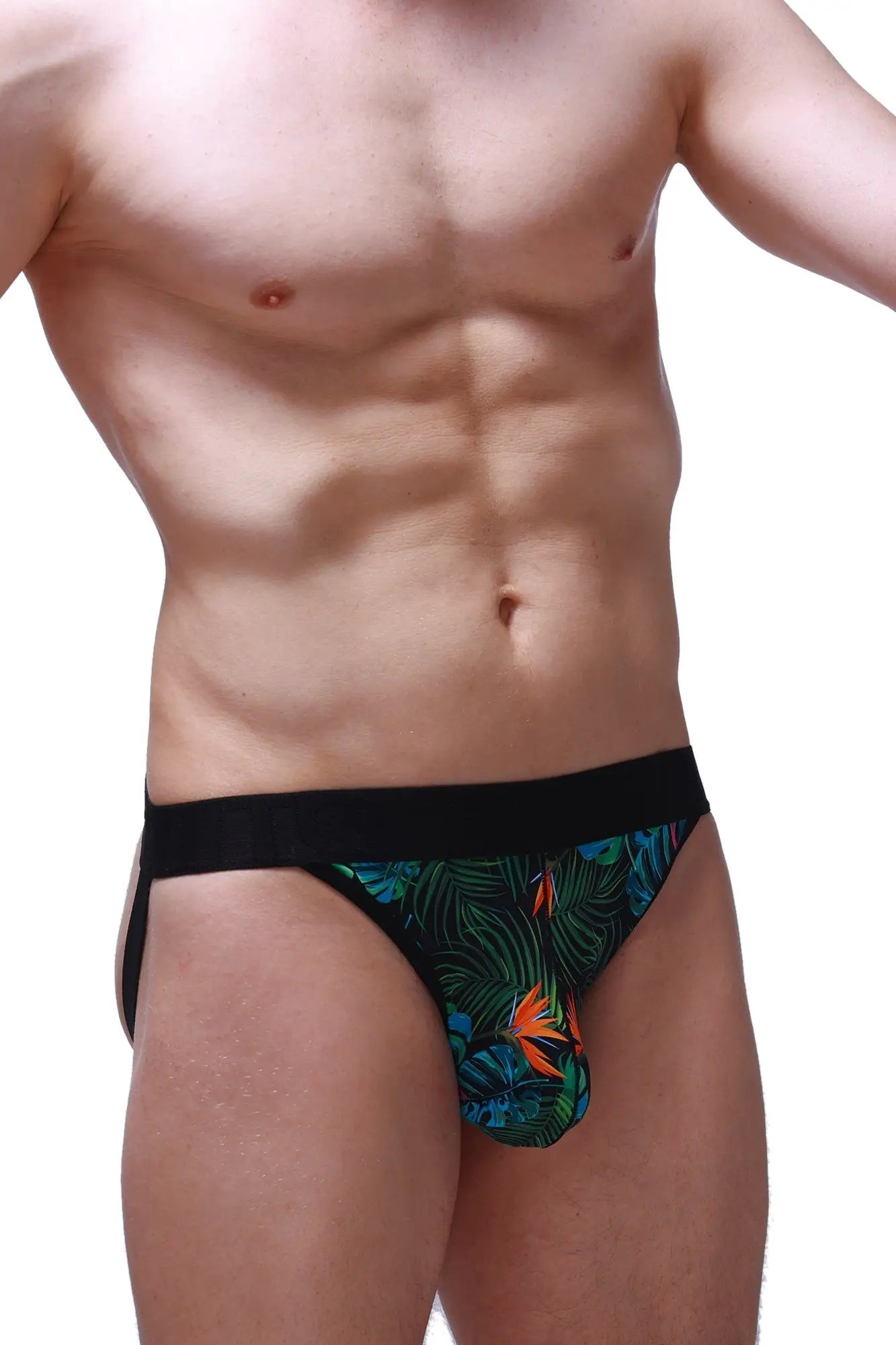 Black and green tropical leaf-patterned jockstrap with orange bird accents in jockstring tropical design
