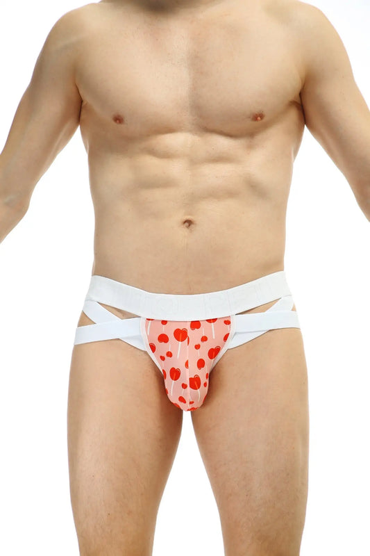 Pink heart patterned jockthong bost sucette briefs with white crisscross straps showing front side