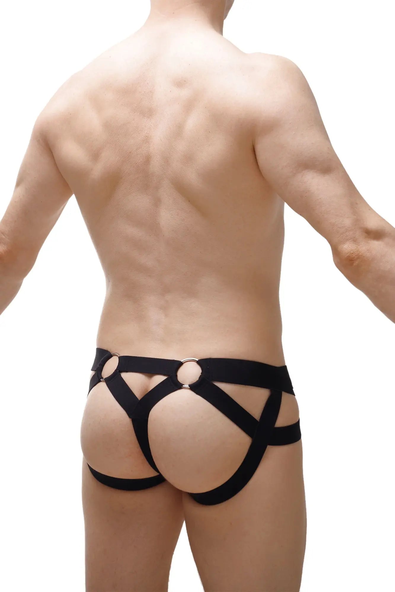 Black leather harness-style briefs with circular metal rings from jockthong bust petitq 2023 collection