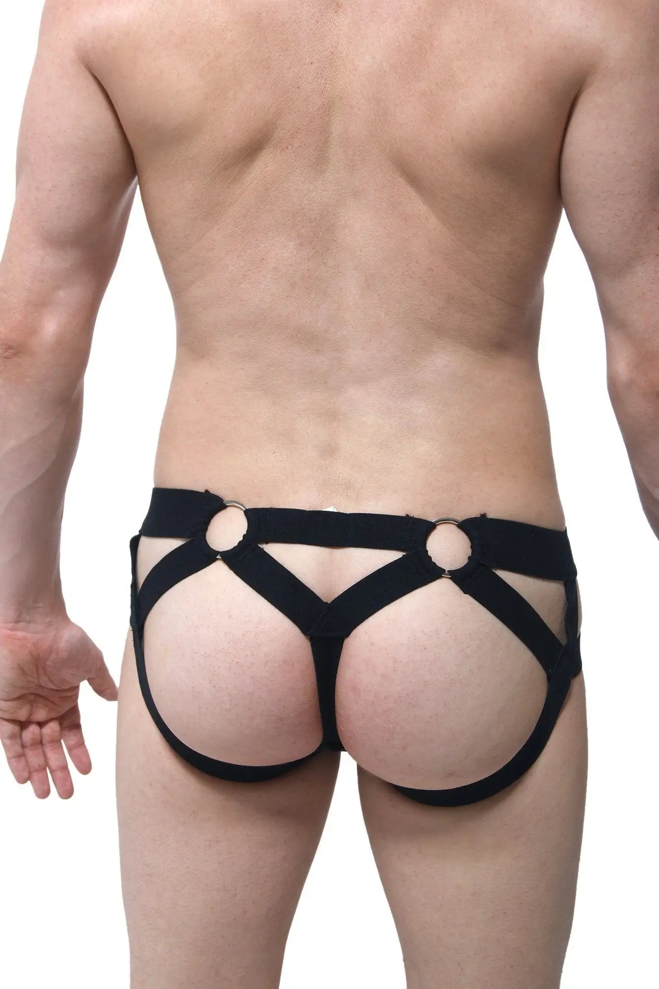 Black elasticated harness-style JockThong Bust PetitQ underwear with circular metal rings at the back side
