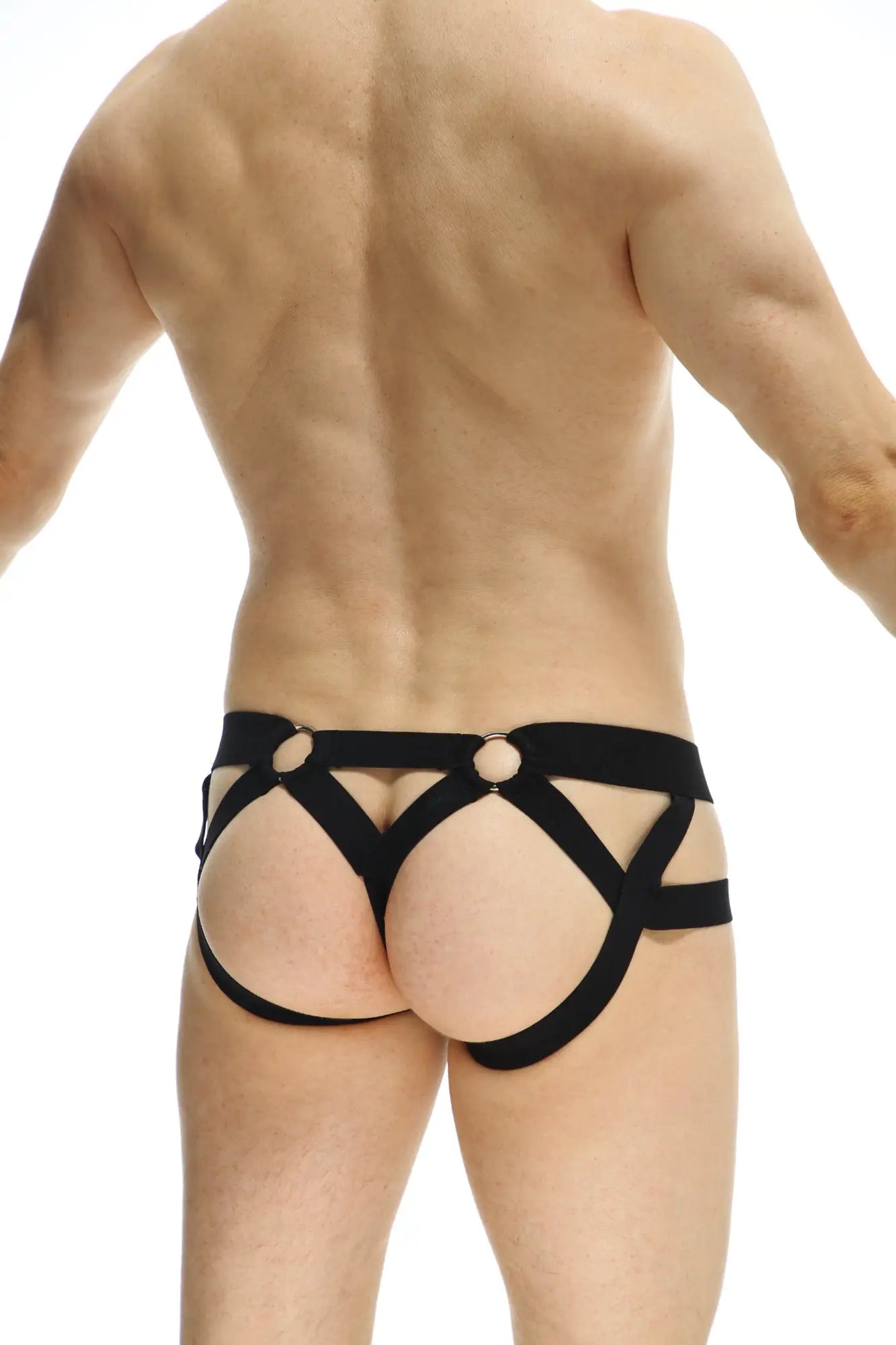 Black strappy harness-style jock thong rider bost with crisscross design and metal rings at the front
