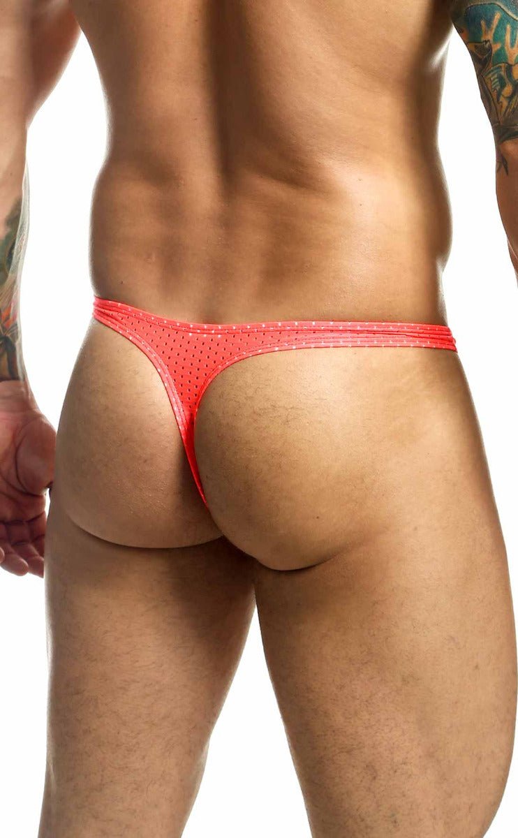 Bright red Joe Snyder Holes thong with mesh texture and sleek minimalist design shown from the back side