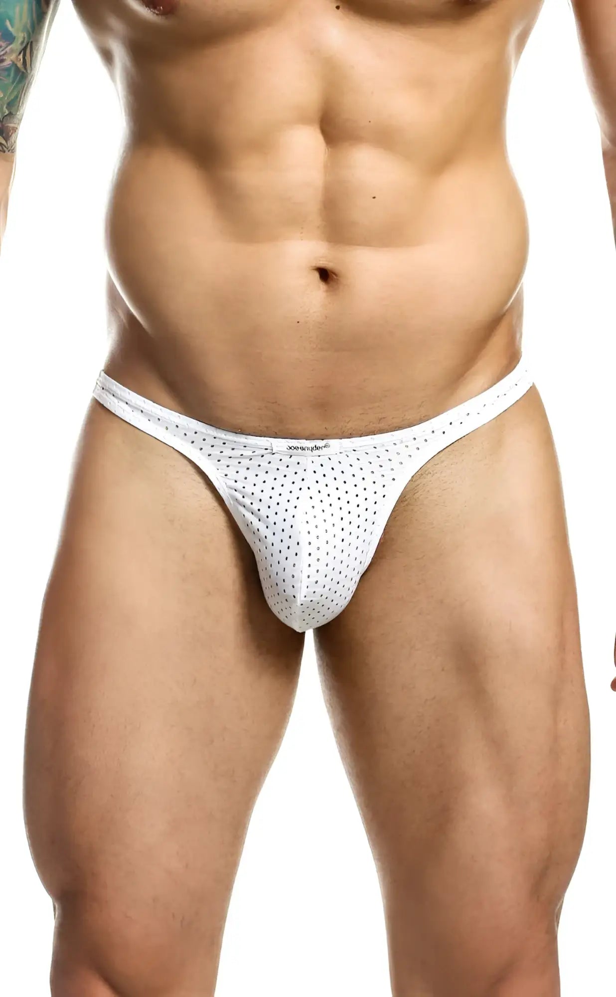 White mesh thong with small black dots by joe snyder showing breathable material and stylish design