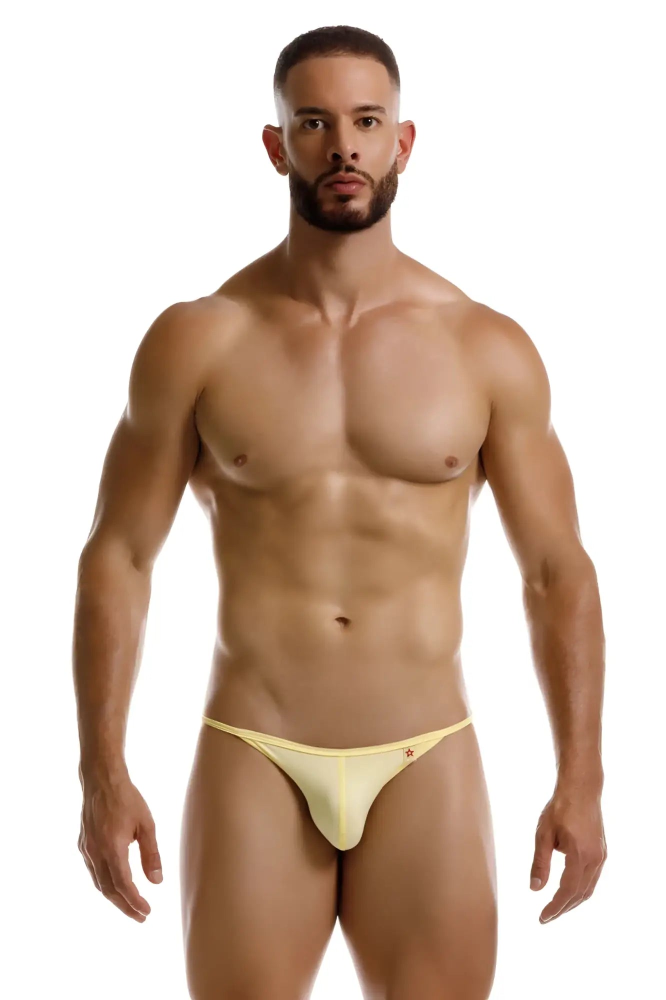 A sleek pale yellow jor 2257 axel bikini thong with a subtle logo on the sideband in smooth fabric