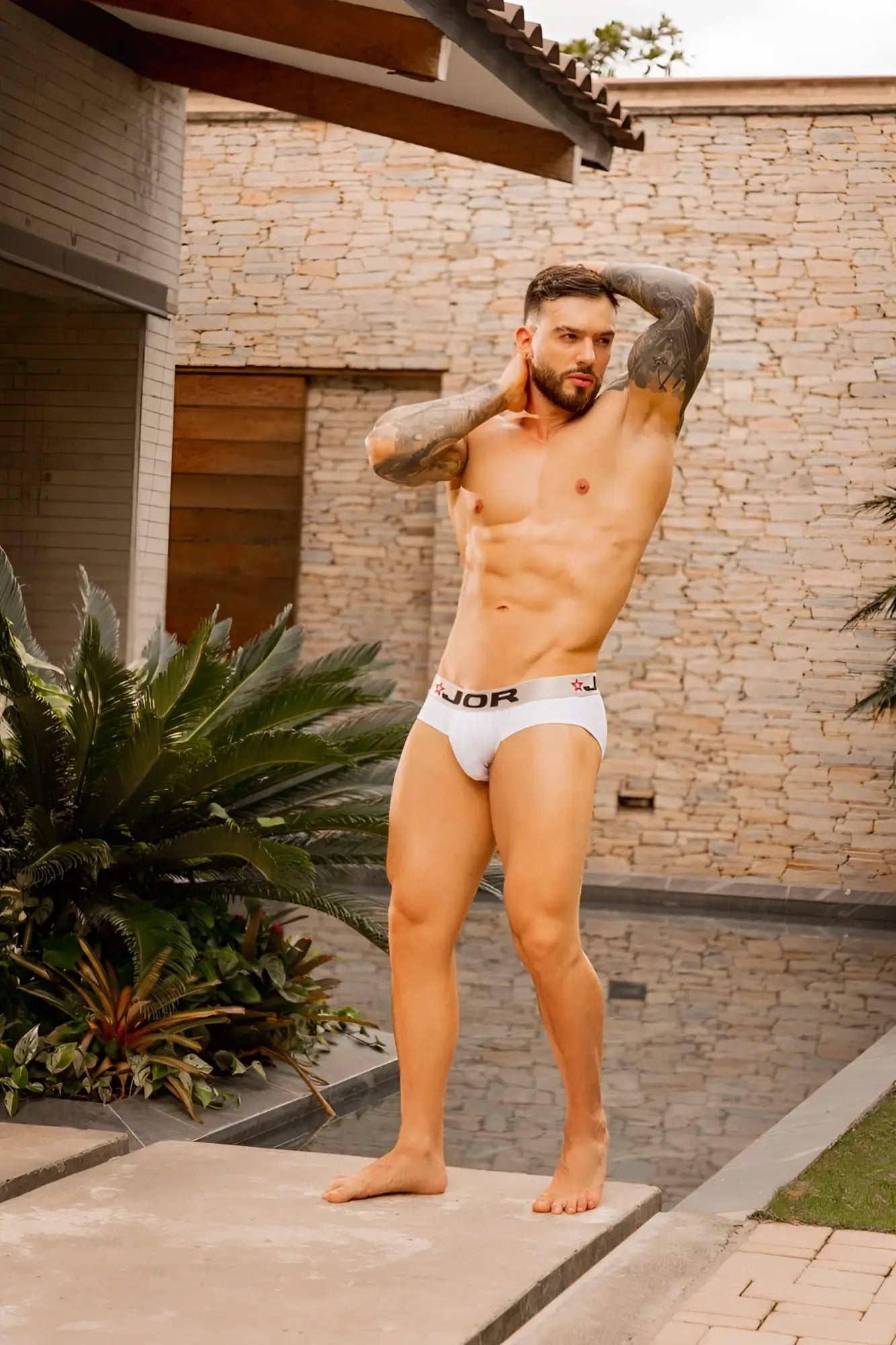 White jor 2331 cronos briefs featuring white branded fabric with a subtle logo on the waistband front view