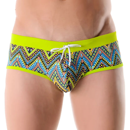 Jor africa brief swimwear size l featuring vibrant neon green trim with bold multicolored geometric tribal patterns