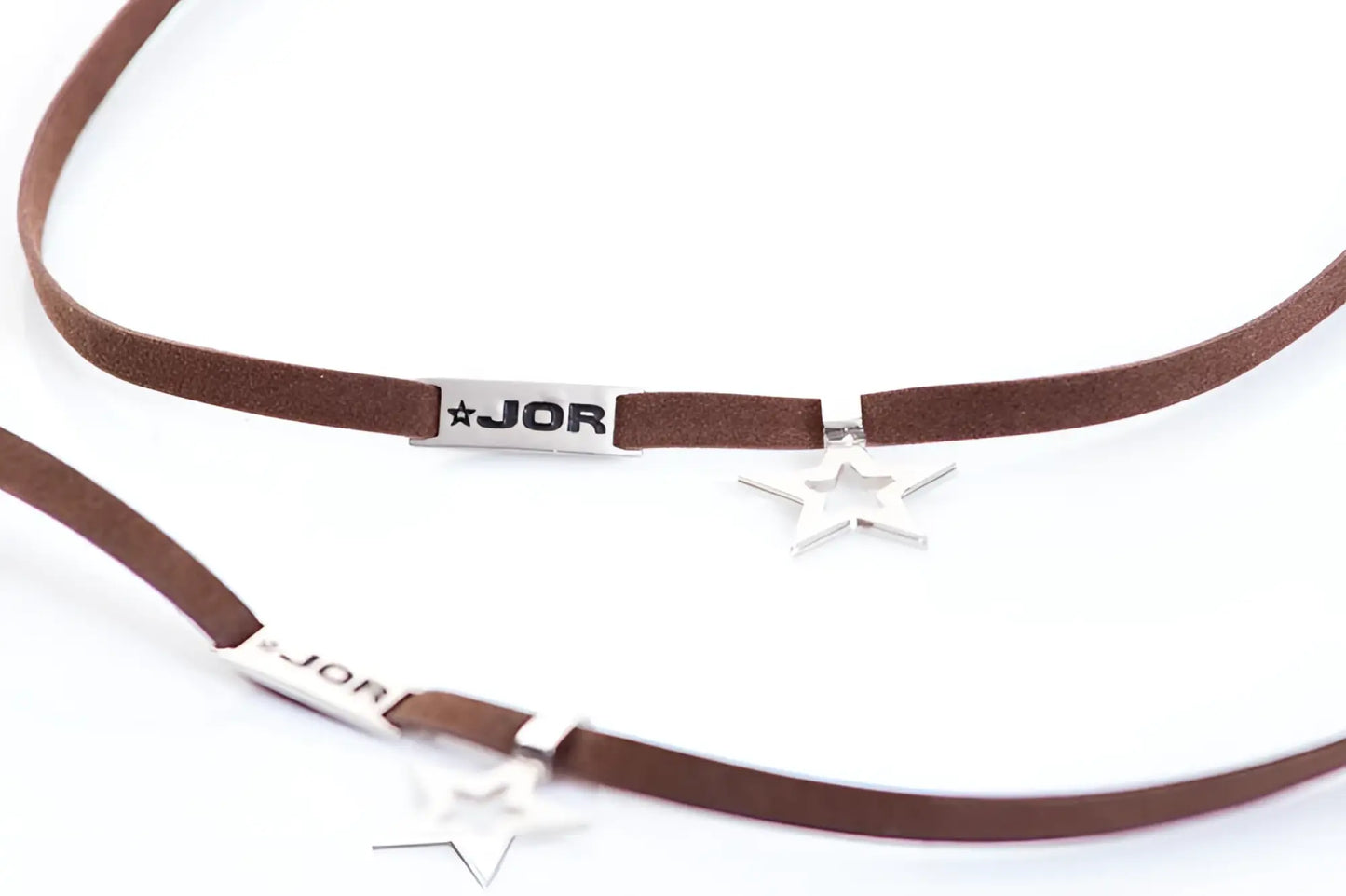Brown suede choker necklace with silver star charms and rectangular jor branded tag in size one size