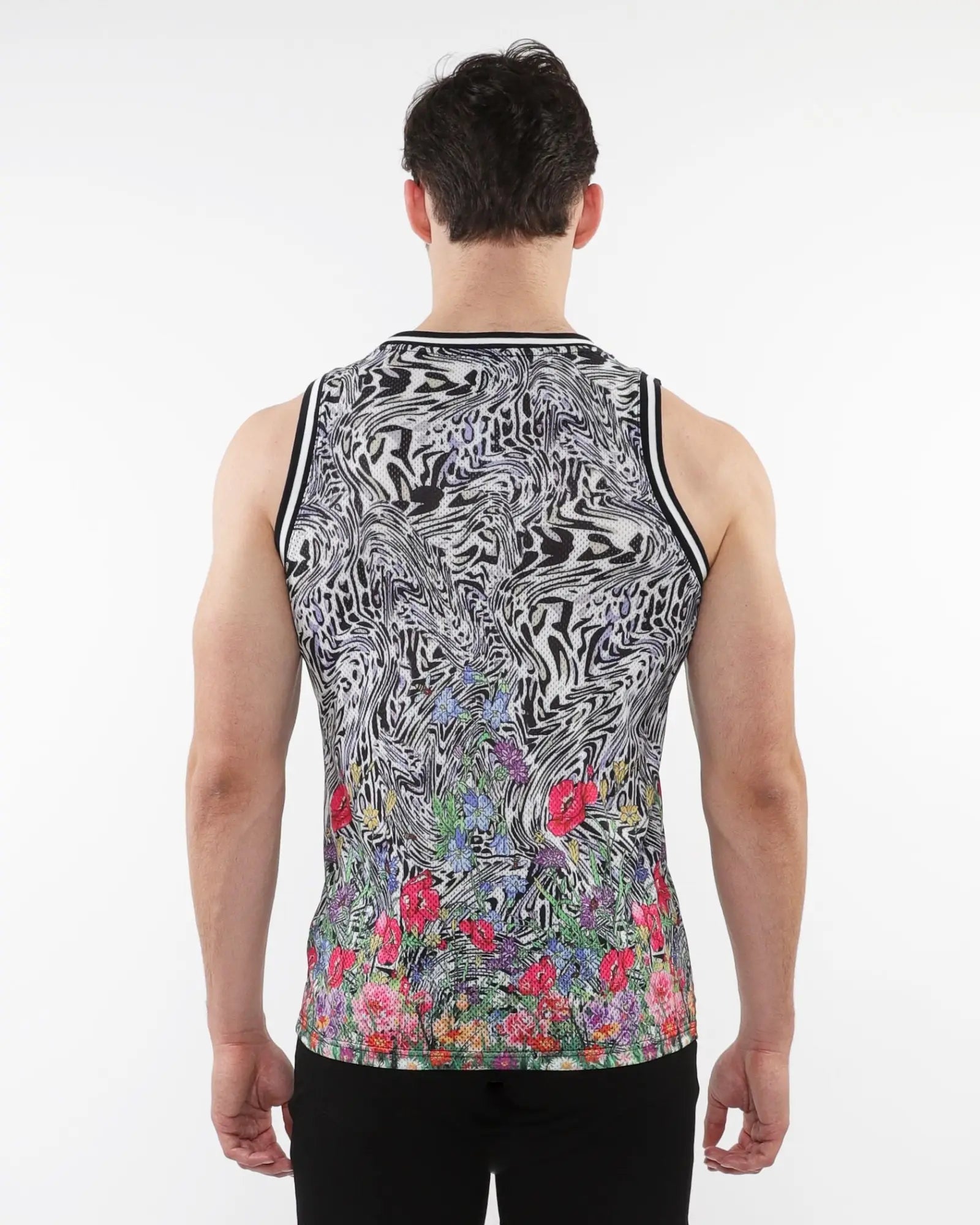 Jungle printed mesh tank with stripe ribbing featuring black and white abstract swirl and colorful floral bottom print