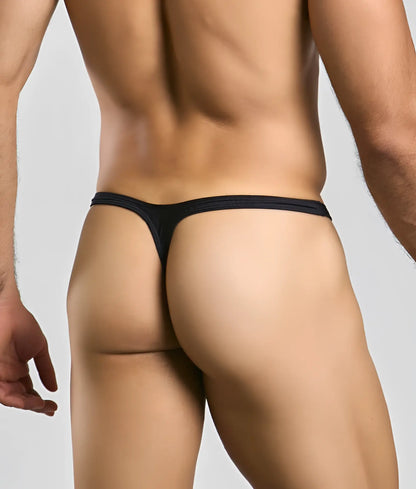 Black Justin + Simon bulge thong made of smooth stretchy fabric with a minimalistic design shown from the back