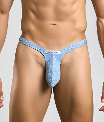 Light blue glittery bulge thong with white justin plus simon brand tag designed for men by Justin plus Simon