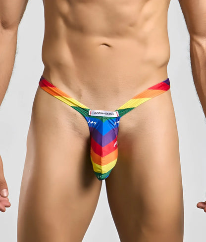 Rainbow-striped bulge thong by justin + simon showing the back side in vibrant multicolor elastic material