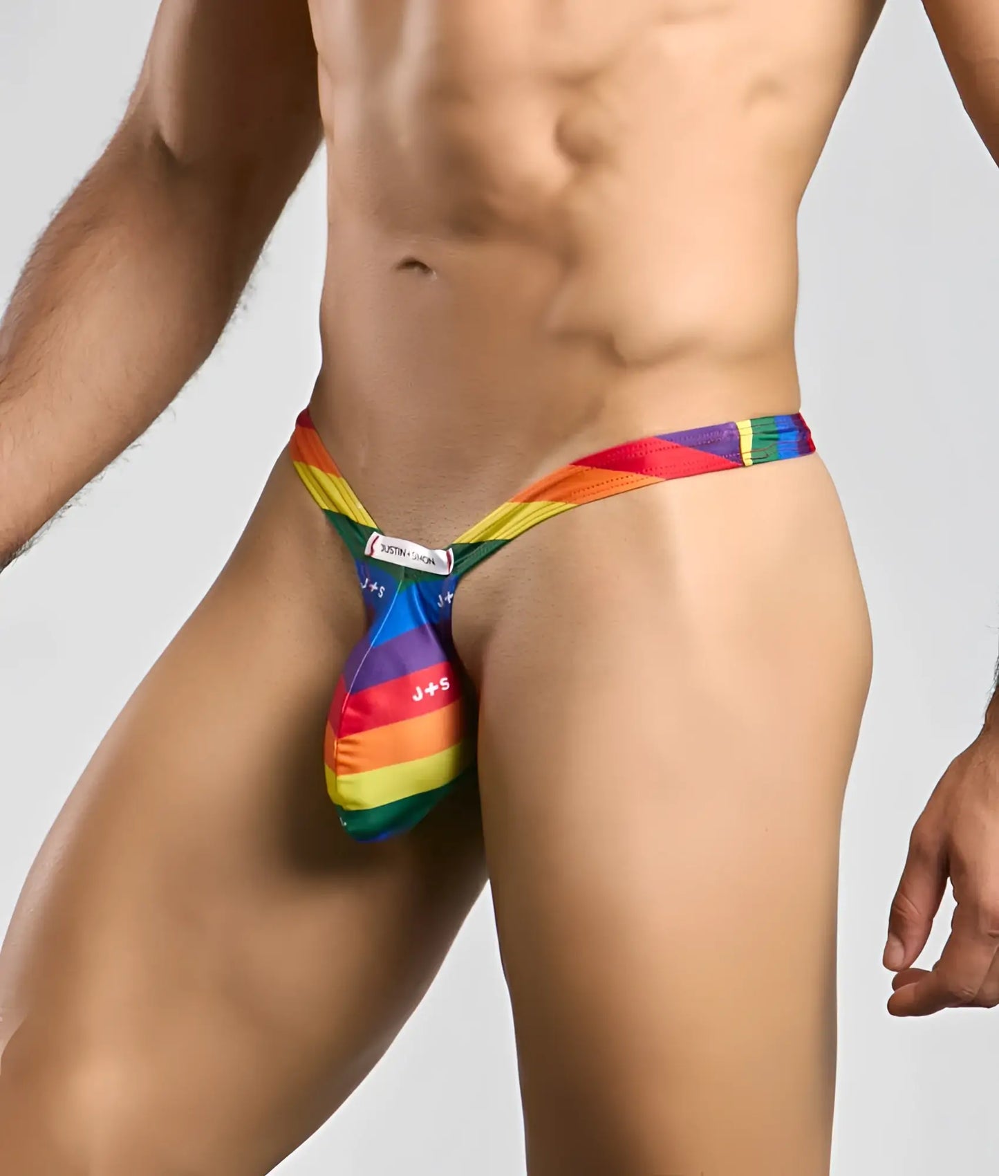 Rainbow-striped justin simon bulge thong j+9 men’s jockstrap with vibrant multi-colored fabric design