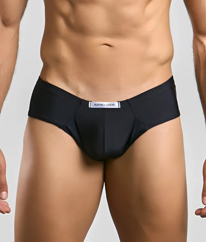 Black justin simon cheek briefs with a sleek form-fitting design and subtle brand tag at the waistband