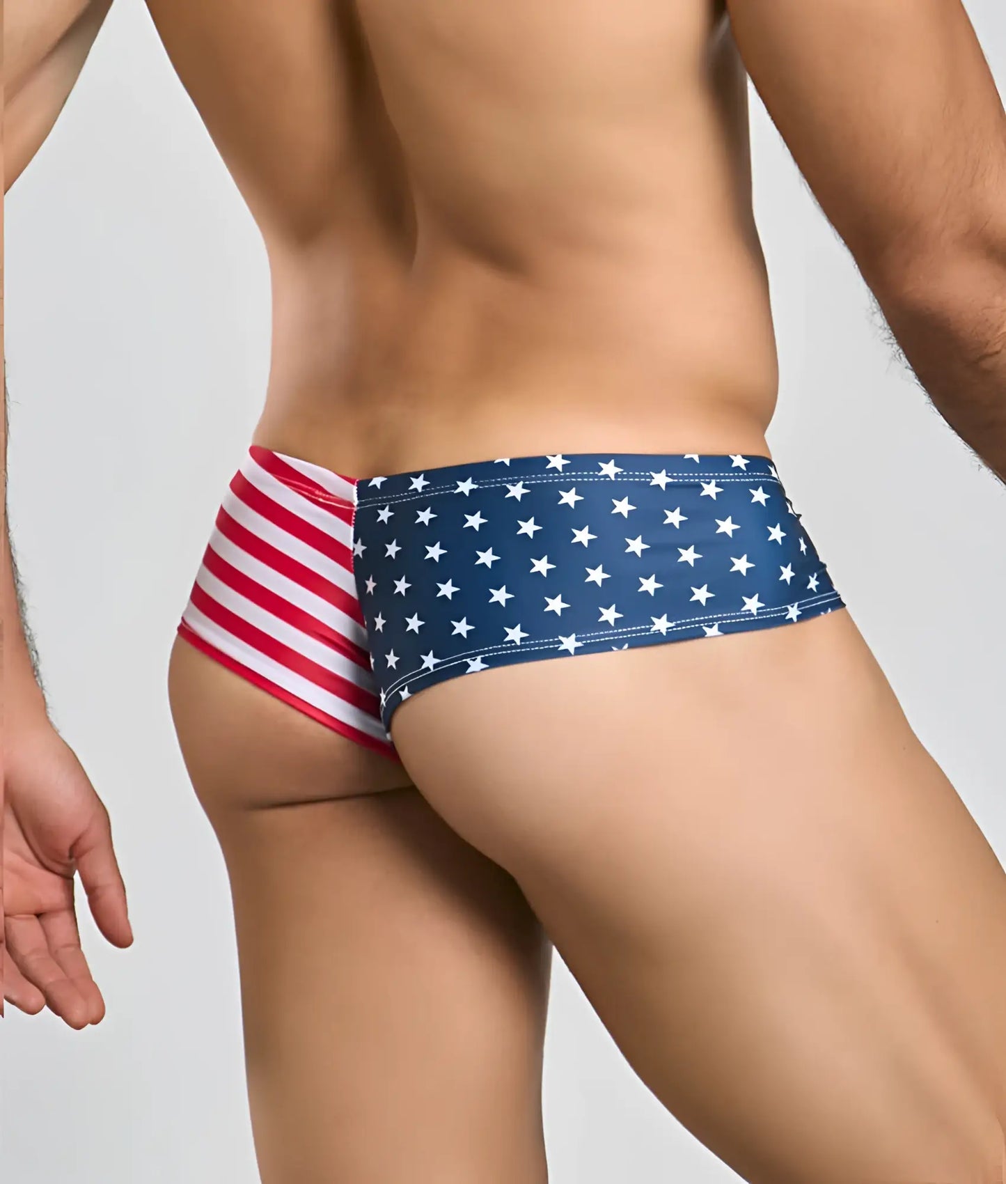 Justin + Simon cheek swim trunks with american flag design featuring blue stars and red white stripes