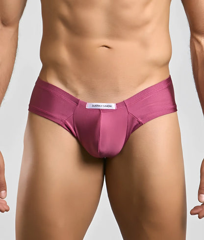 A sleek magenta satin brief from justin simon cheek collection showcasing smooth fabric and vibrant color