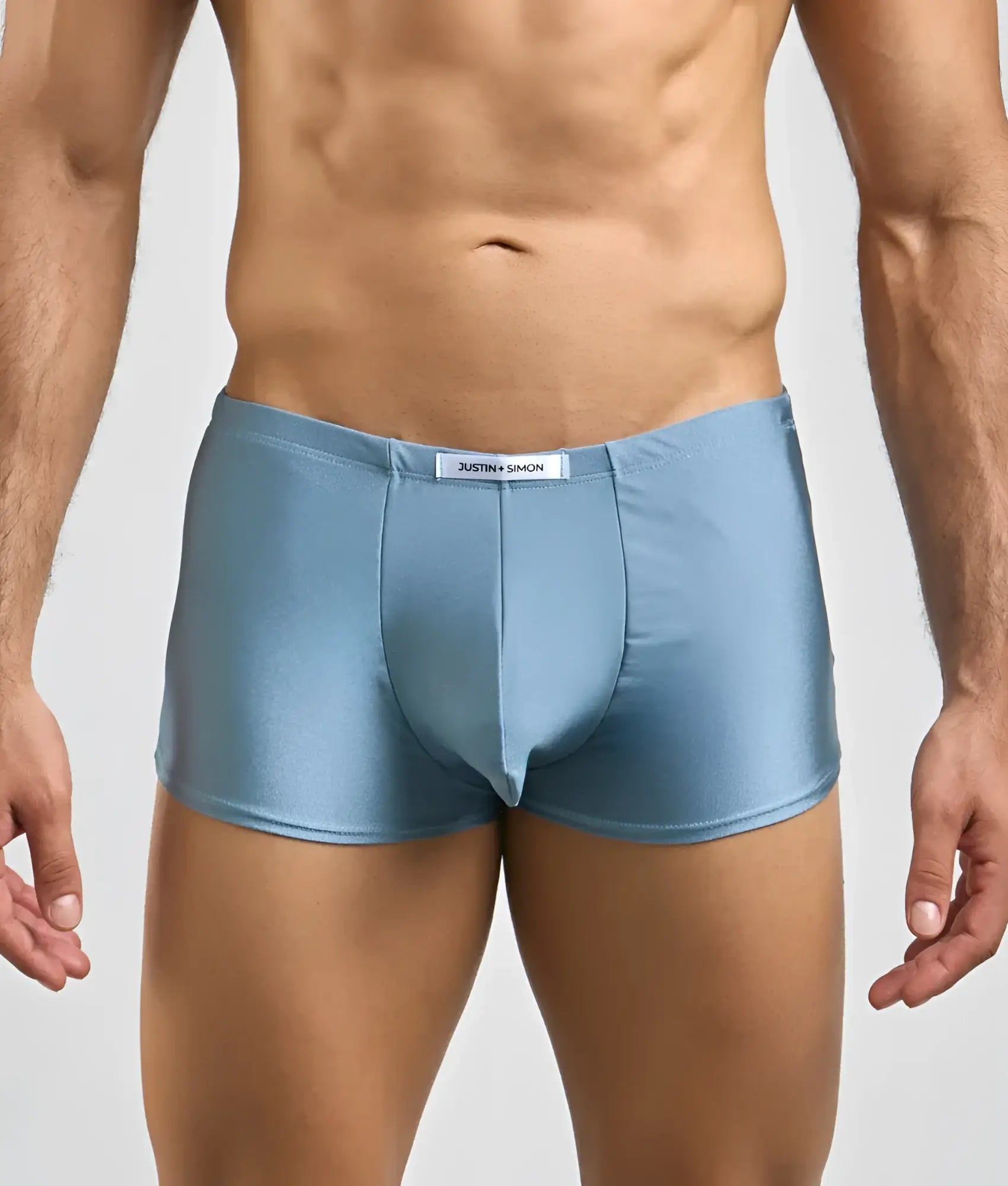 Justin + Simon classic boxer light blue shiny satin briefs with white brand tag at the waistband front view