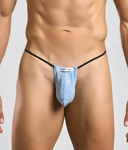 Justin + Simon classic g-string bulge in shimmering light blue glitter with black elastic straps and white label visible